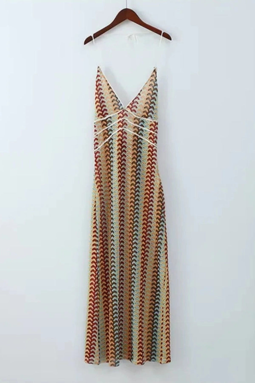 Model viewed from the back wearing the Kouvr Fashion 70s-inspired retro wave print halter maxi dress, showcasing the open-back design