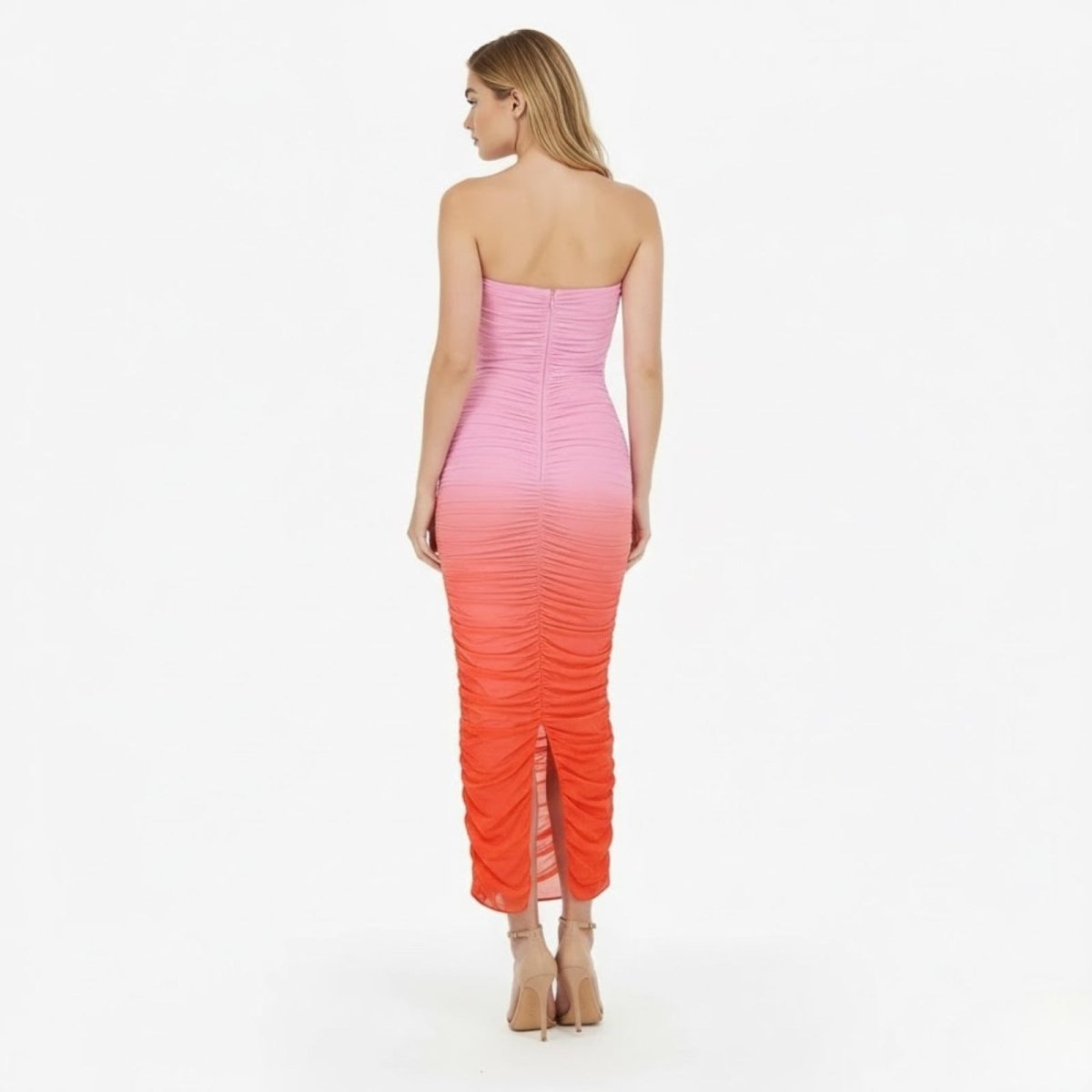 Back view of the Kouvr Fashion ruched strapless midi dress, highlighting the zipper closure and body-hugging fit.