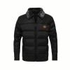 Black Kouvr jacket with a brand logo on a dark background