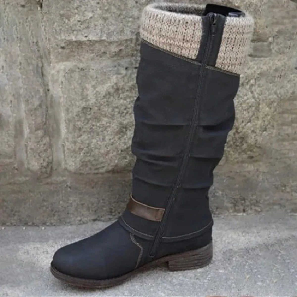 Inner side view of the black Kouvr Fashion boot, displaying the full-length functional zipper for easy wear.