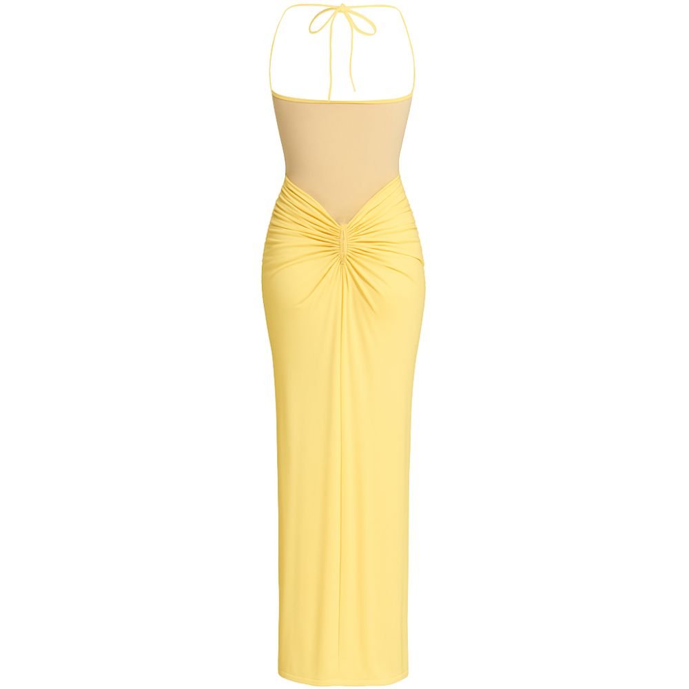Model wearing the Kouvr Fashion yellow halter neck maxi gown with sheer midriff panel and draped skirt