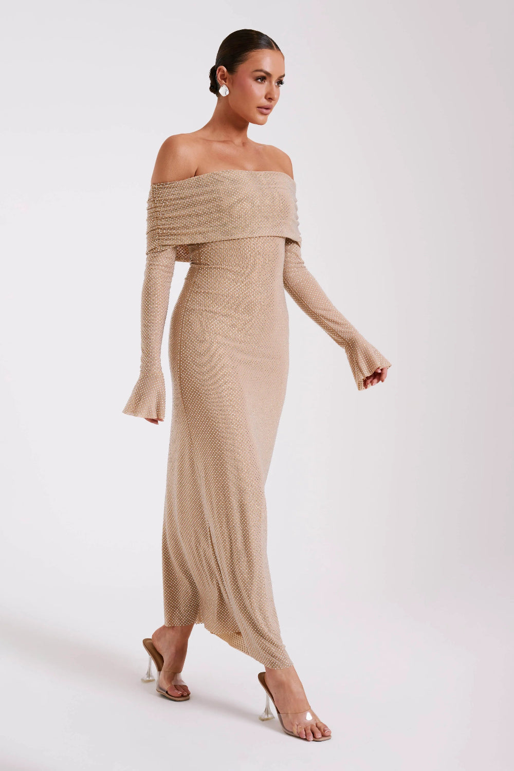 Model from behind in Kouvr Jada Beige off-the-shoulder formal gown with flare sleeves