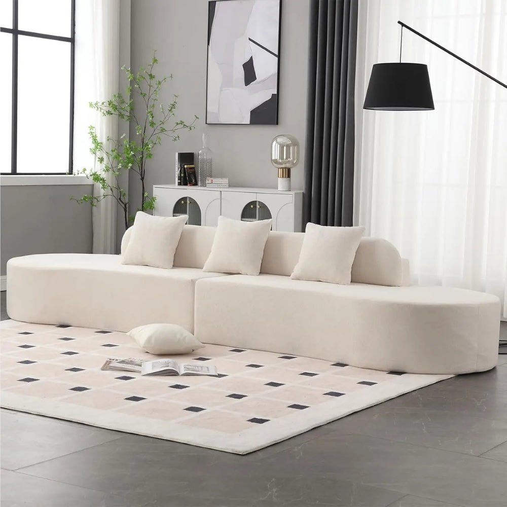 luxe couch," "minimalist sofa," "low-profile sectional," "bouclé fabric sofa," "cloud sofa alternative," and "statement living room furniture