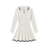Flat lay of the Maisy two-piece set, displaying the white cable knit polo sweater and pleated mini skirt with black contrast tipping details.