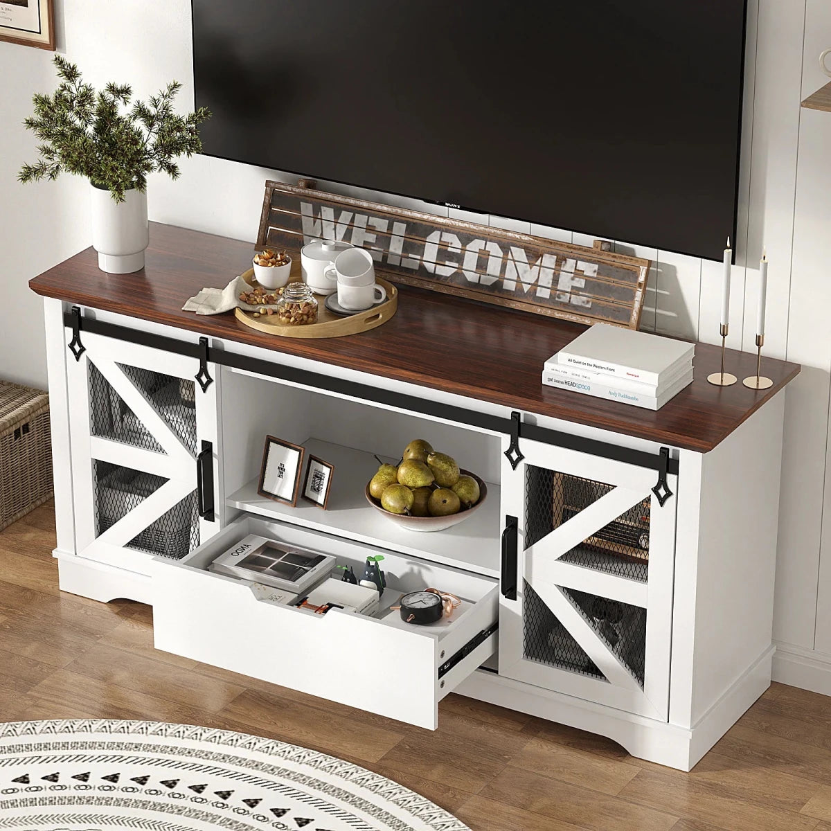 The Kouvr farmhouse media console with its central storage drawer open, revealing organized compartments for electronics and accessories, highlighting its functional design.
