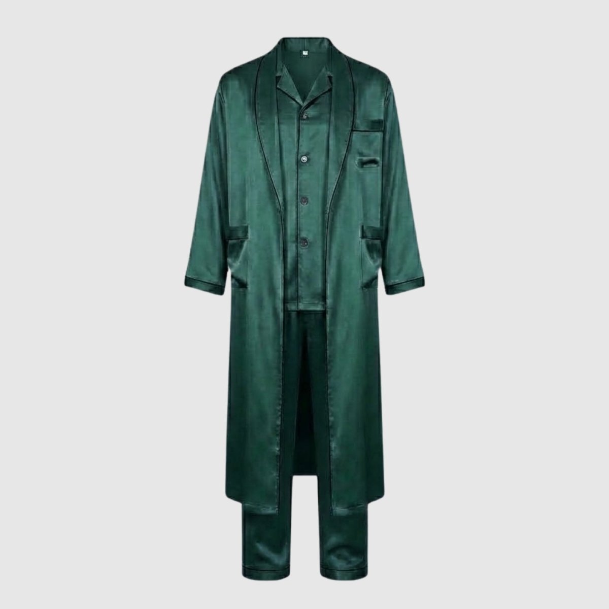 Flat lay of the Kouvr three-piece men's loungewear set in  green satin, showing the pajama shirt, pants, and open robe against a light grey background.