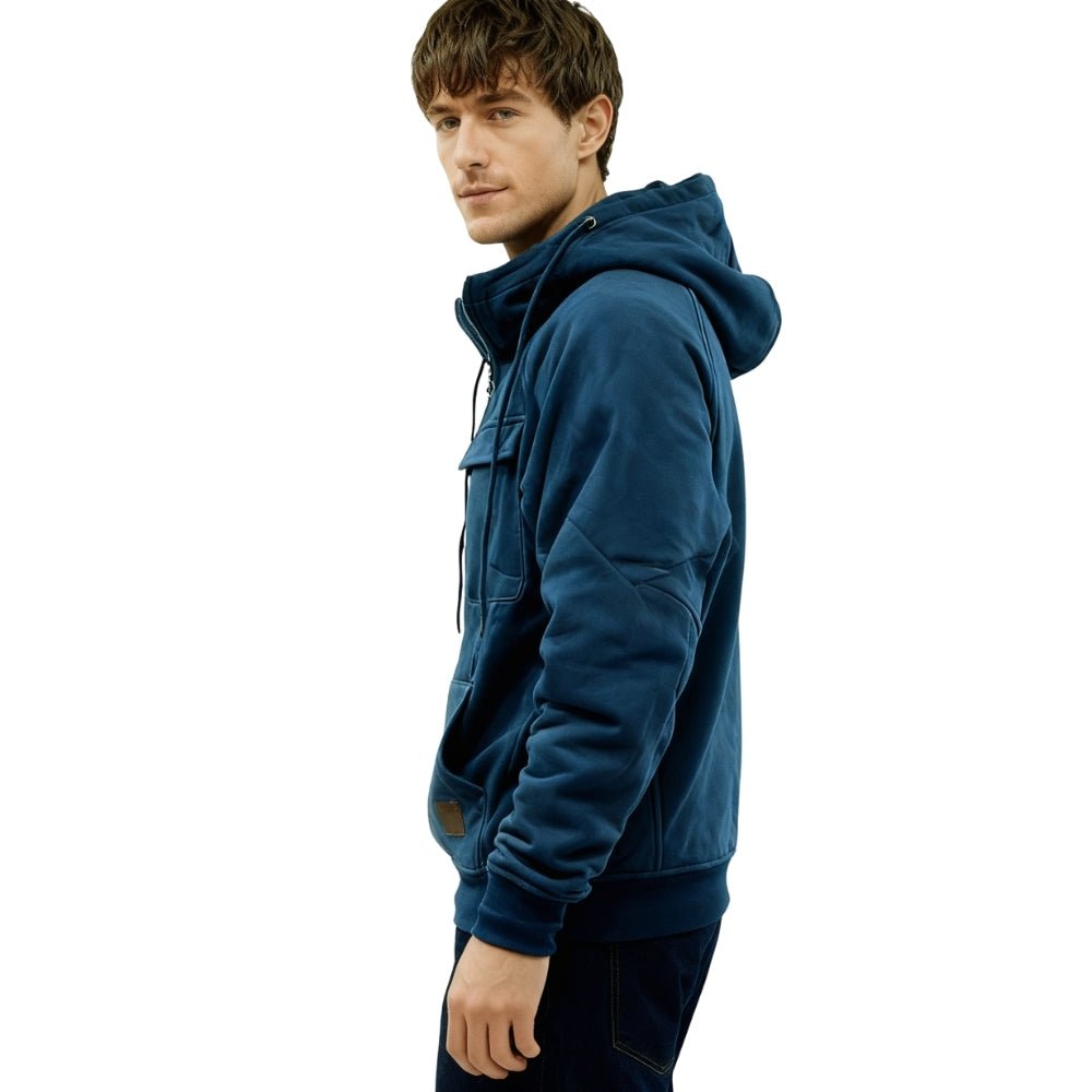 Side profile of a model wearing the Kouvr Dominic utility hoodie, highlighting the heavyweight fabric and sleeve construction.
