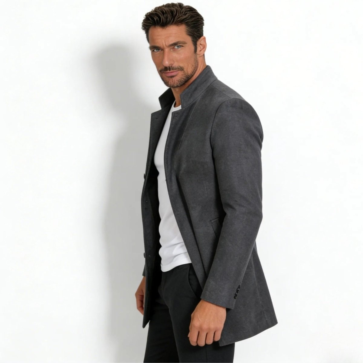 Side profile of a man wearing the Kouvr Fashion slim fit grey stand collar topcoat, highlighting its modern silhouette and tailoring.
