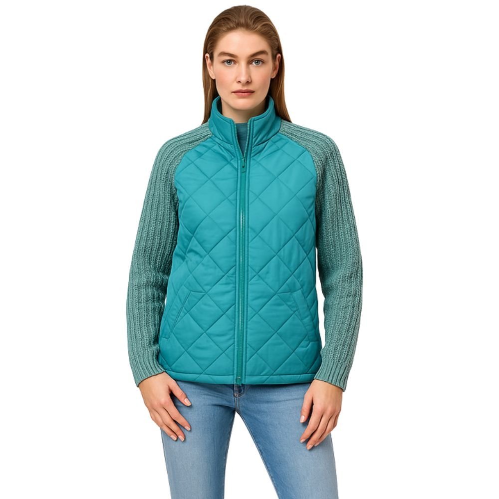 Model wearing the Kouvr Arlington Quilted Hybrid Jacket with blue jeans