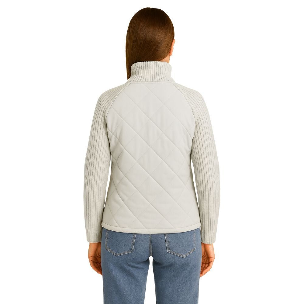 Model wearing the Kouvr Arlington Quilted Hybrid Jacket with blue jeans