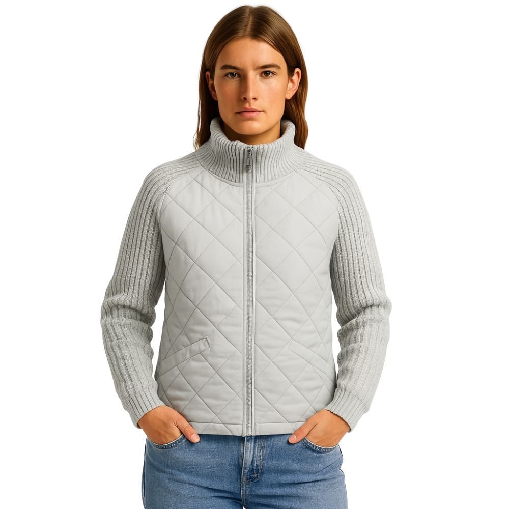 Model wearing the Kouvr Arlington Quilted Hybrid Jacket with blue jeans