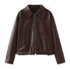 Brown Kouvr leather jacket on a plain background