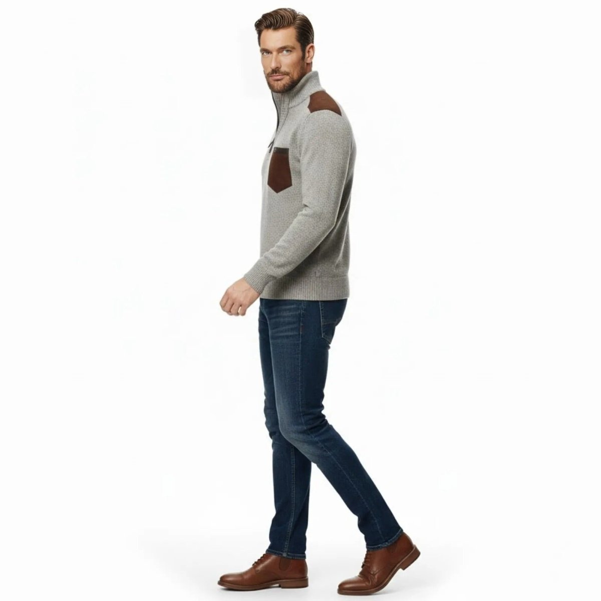 Male model in a side profile view walking, wearing the beige Kouvr Soren quarter-zip sweater, showcasing its tailored fit and shoulder patch detail.

