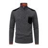 Flat lay product shot of the Kouvr Soren half-zip sweater in dark grey, detailing the zipper, suede pocket, and contrast collar.