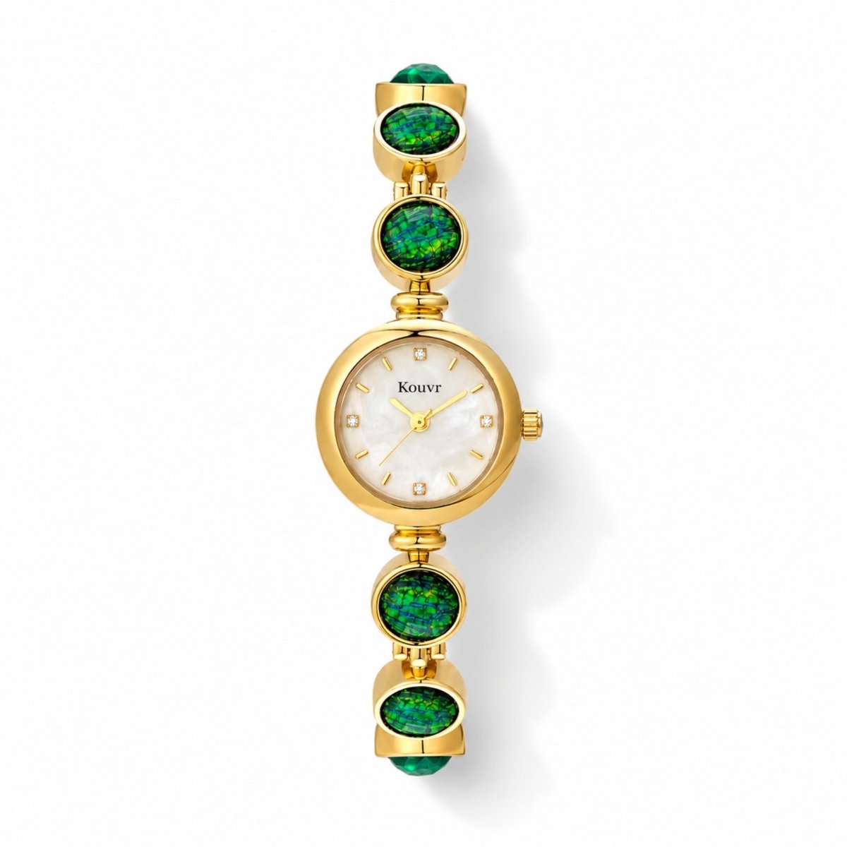 High-resolution flat lay view of the Kouvr gold women's watch highlighting the bright mother of pearl dial, crystal accents, and vibrant green stones.