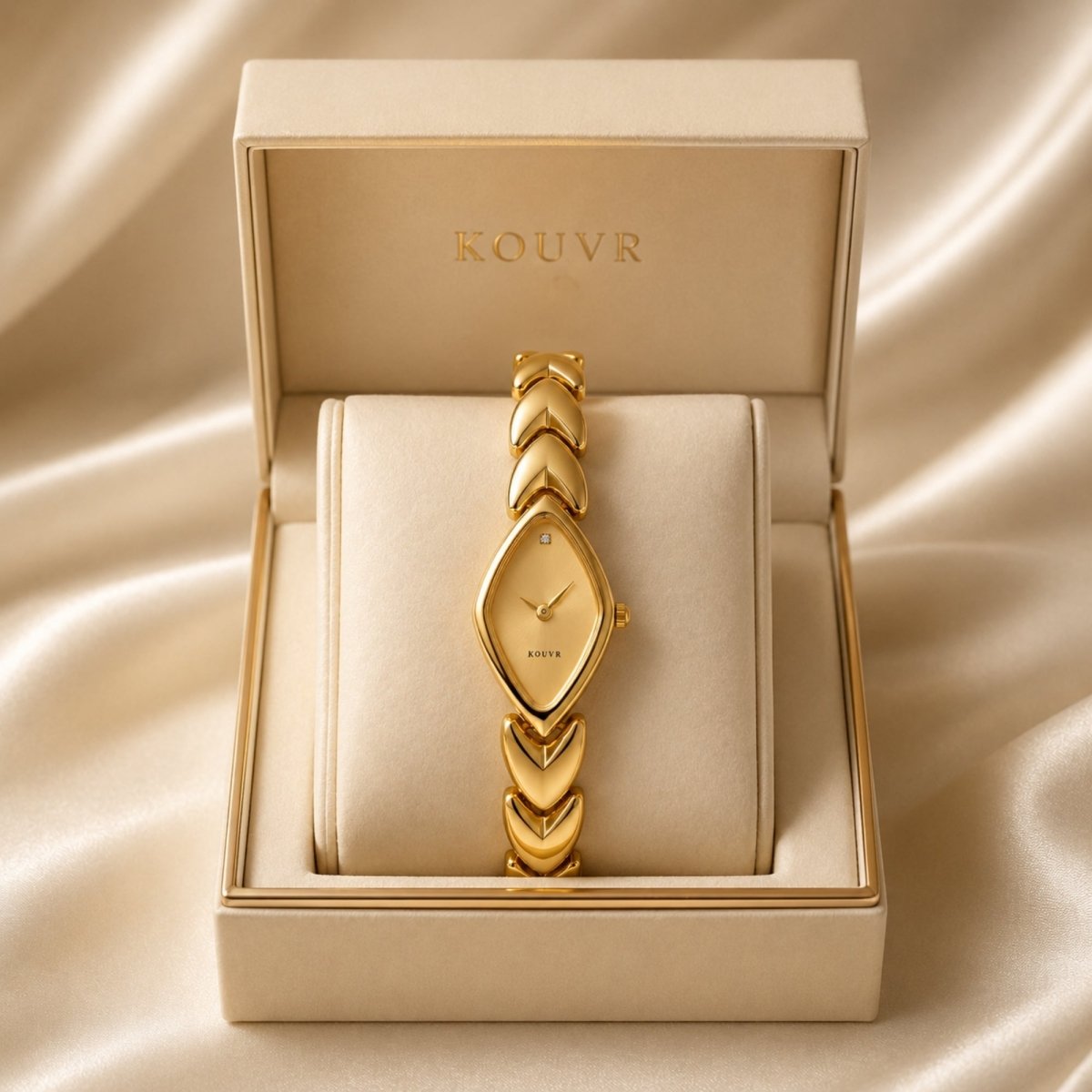 Women's vintage gold watch by Kouvr displayed in a luxury cream velvet presentation box showing the diamond shaped dial