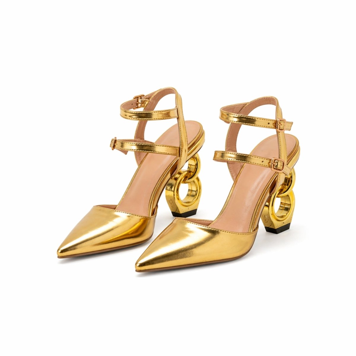 A pair of Kouvr Zuleika women's luxury pumps in metallic gold, featuring a pointed toe, double ankle straps, and a unique sculptural interlocking chain heel, on a white background.
