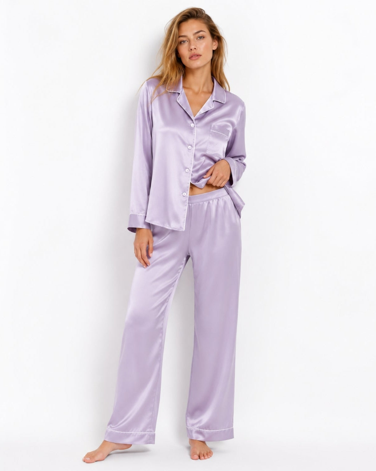 profile of a woman wearing elegant lavender purple satin two-piece sleepwear pajamas with white piping.