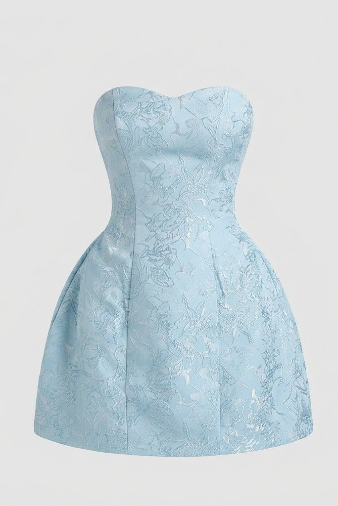 Flat lay front view of the light blue strapless mini dress showing the tailored seams and subtle sweetheart neckline against a grey background.