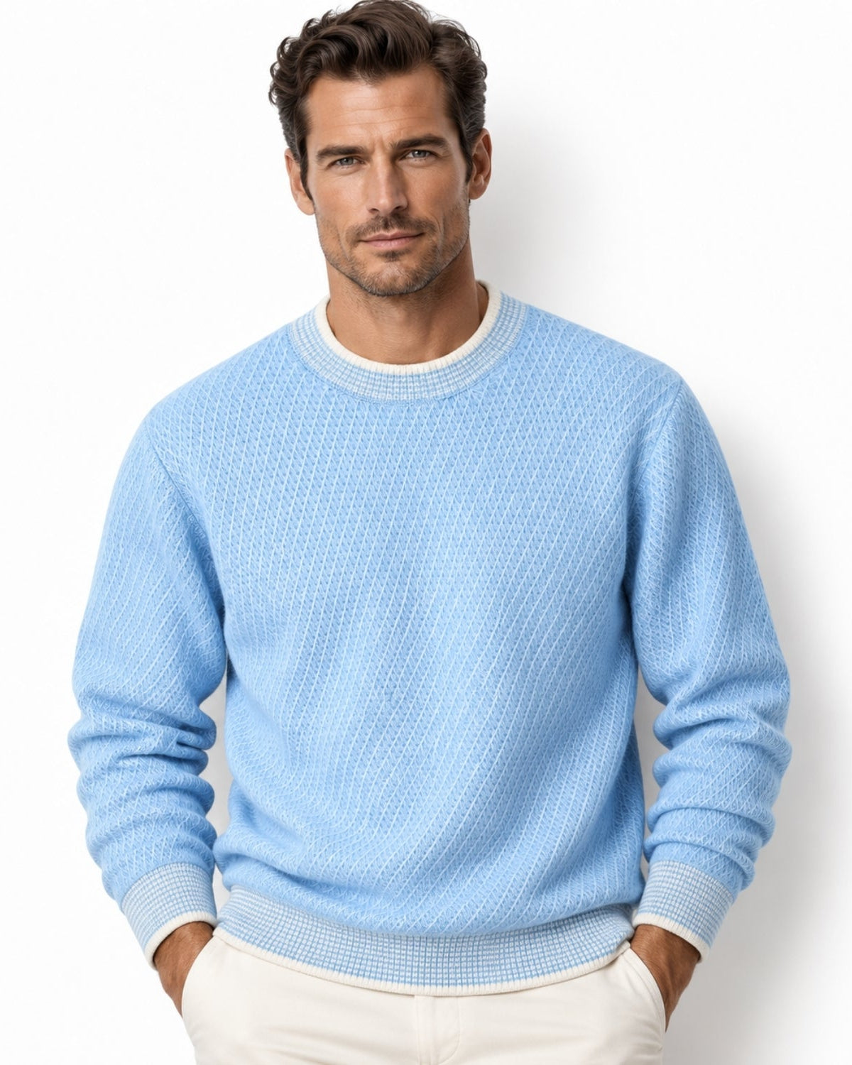 Handsome man wearing a light blue luxury textured diagonal knit crewneck sweater with contrast collar, front view.