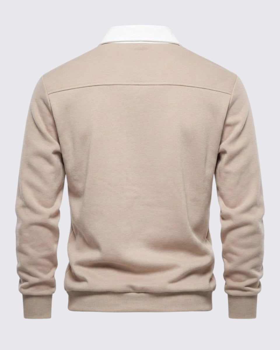 Flatlay of the back of the men's polo sweater, showing the clean design and horizontal yoke seam.