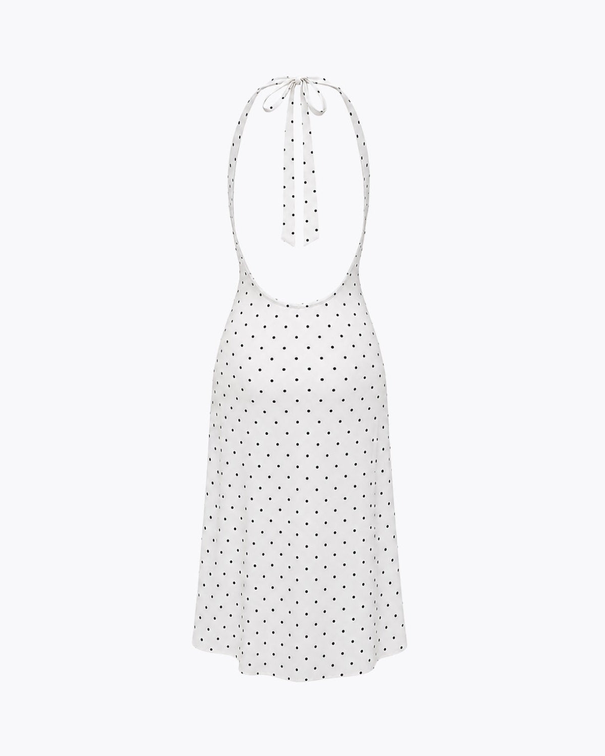 Flat lay back view of an open back halter tie polka dot dress emphasizing the adjustable neck ties and low back cut.