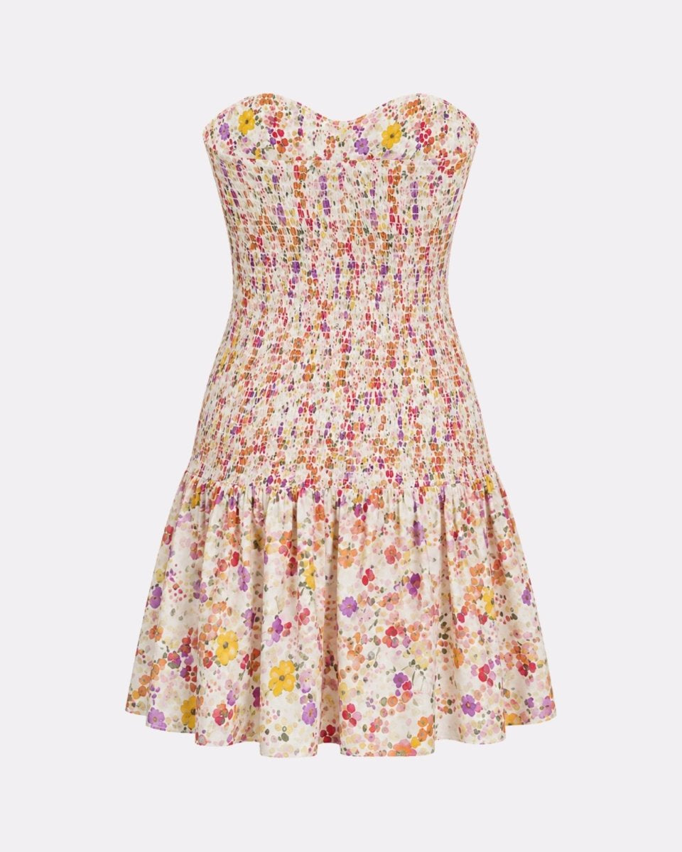  Back flat lay studio shot displaying the high-quality elasticized smocking and ruffled hem of the Kouvr summer vacation mini dress.