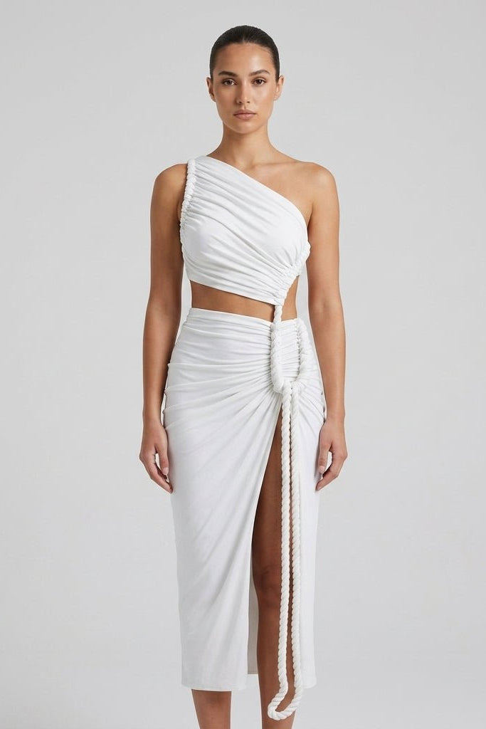 Close up styled view of the Fenlo Form white resort wear maxi dress highlighting the twisted rope waist detail and draped stretch knit fabric.
