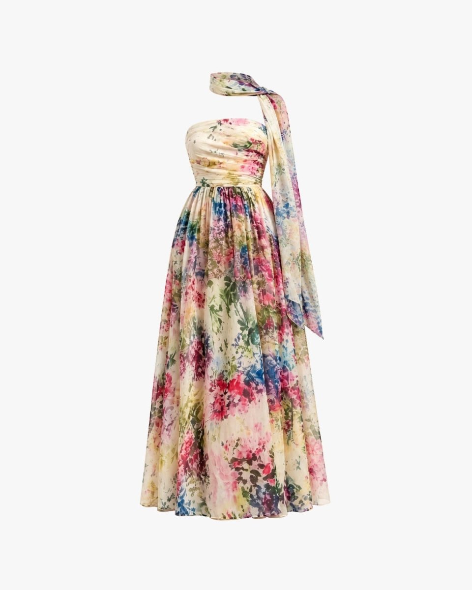Ghost mannequin front view of the luxury strapless floral gown displaying the vibrant painterly print, structured bodice, and draped neckline.
