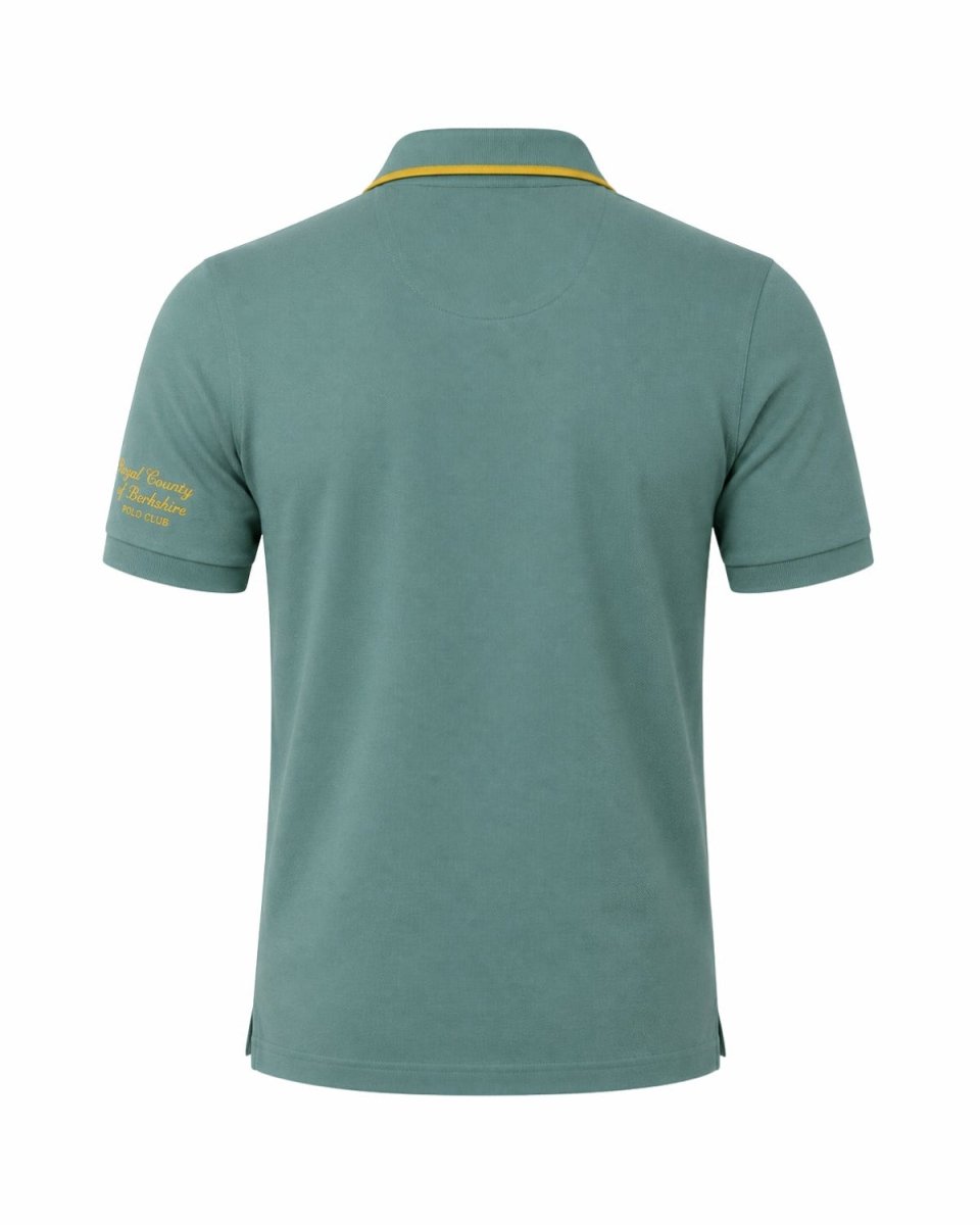 A sage green short-sleeve polo shirt shown from the back, featuring a thin yellow collar trim and yellow embroidered text on the left sleeve, set against a plain white background.