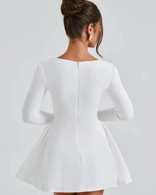 White dress with long sleeves on a gray background