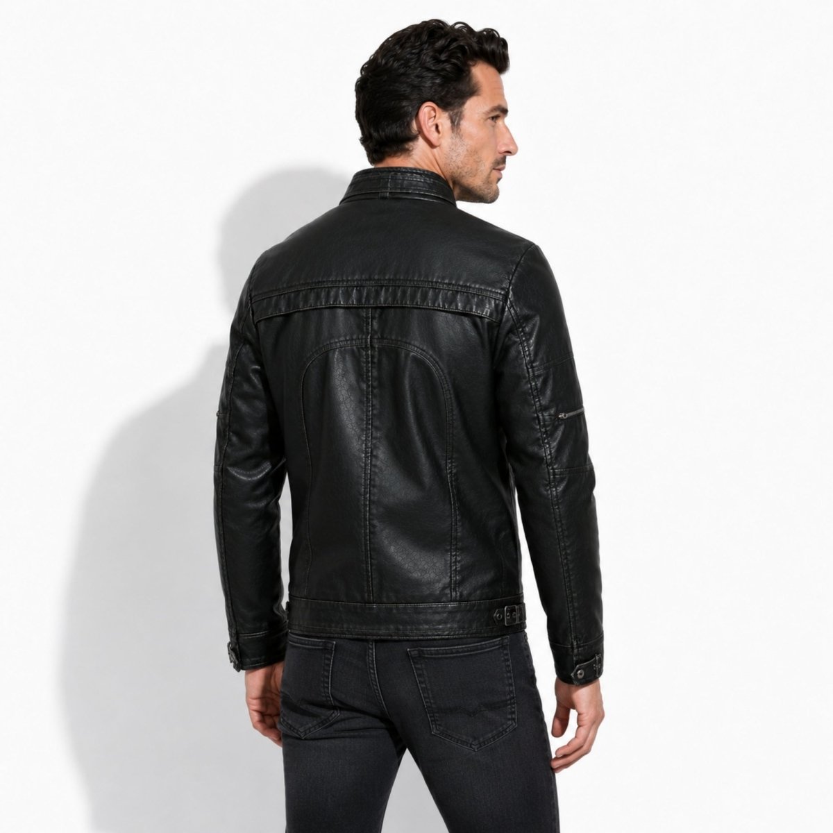 Back of Kouvr mens black leather motorcycle coat demonstrating tailored fit and shoulder articulation.