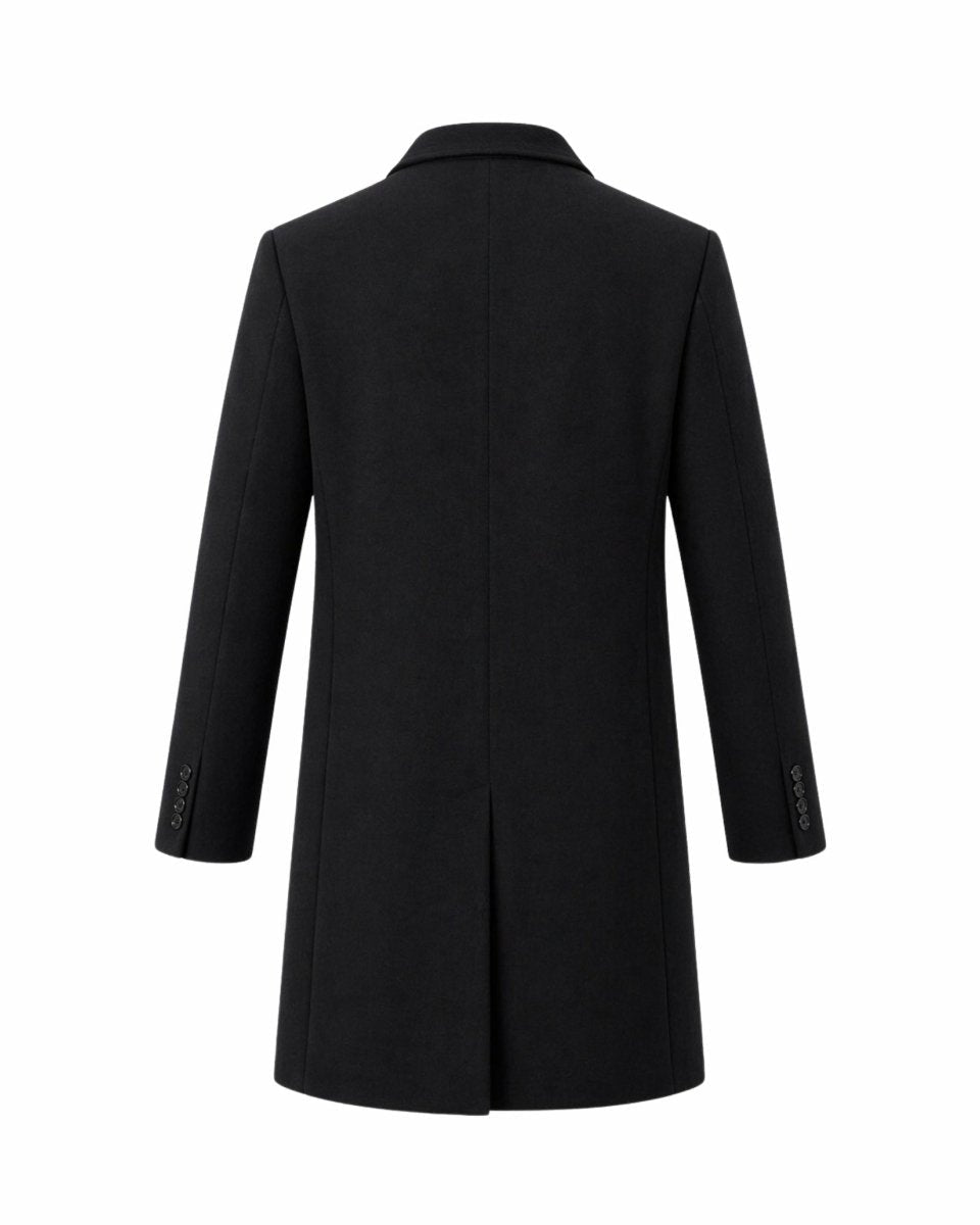 Ghost mannequin back view of men's black formal winter topcoat highlighting the center vent and structured seams.