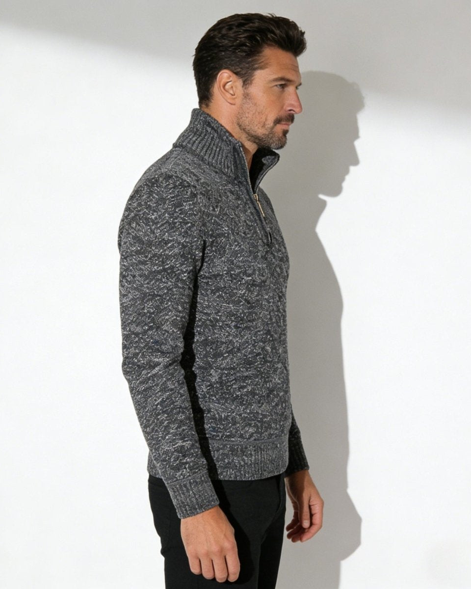 Side profile of a male model in the grey quarter-zip funnel neck sweater, highlighting the garment's silhouette.