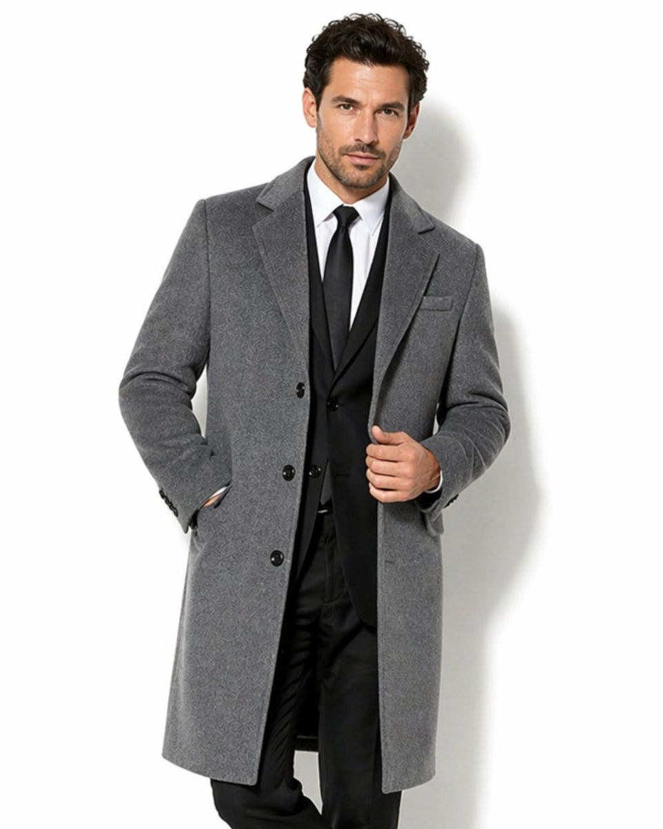 Front view of men's grey tailored overcoat featuring a single breasted wool blend topcoat design over a black suit, ideal for formal winter styling.