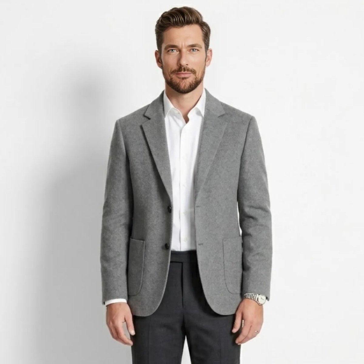 Front view of men's grey wool blend tailored blazer worn with white dress shirt
