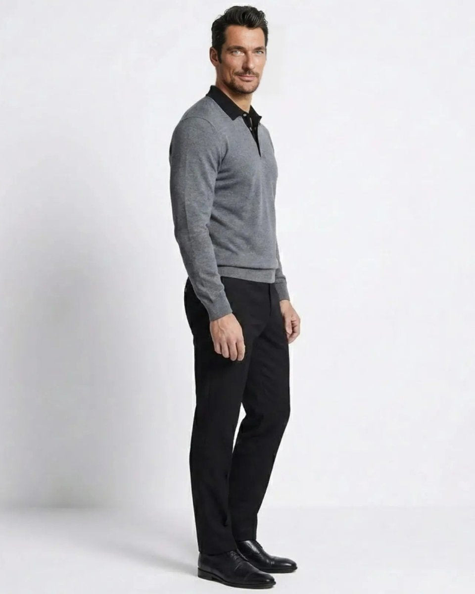 Side profile of a man wearing the heather dark grey and black long-sleeve polo sweater, showcasing its tailored fit.