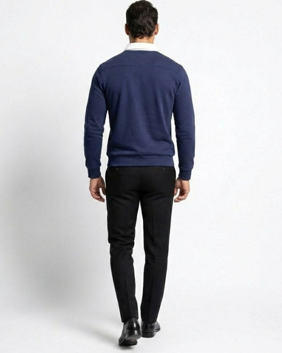 Back view of the men's navy blue knit polo, highlighting the clean lines and tailored fit from behind.