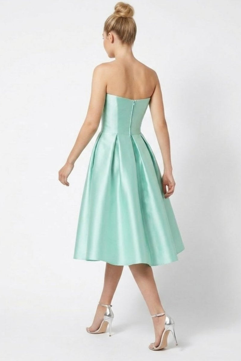 Back view of Fenlo Form mint green satin midi dress showing invisible zipper and pleated A-line skirt
