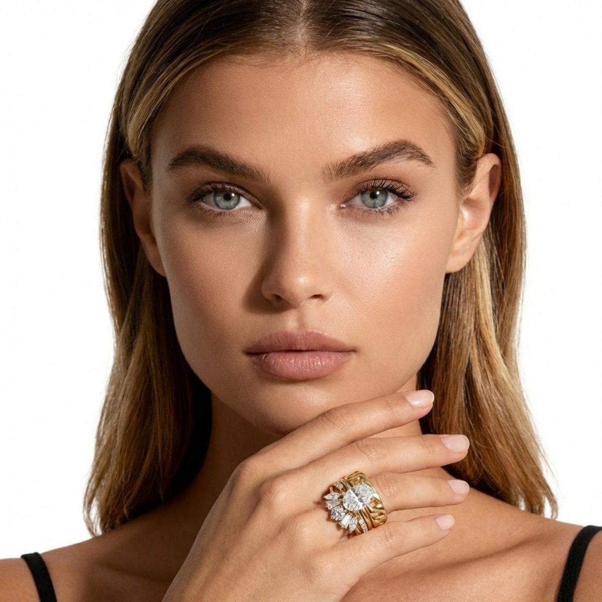 A model showcasing the bold Kouvr Emersyn diamond ring suite on her hand, a luxury bridal set in yellow gold.
