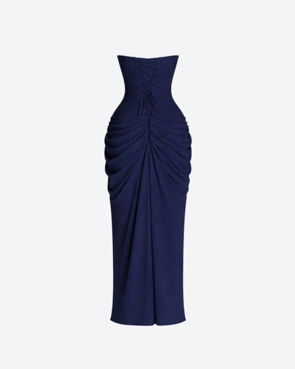 Navy blue strapless gown with ruched design on a light gray background