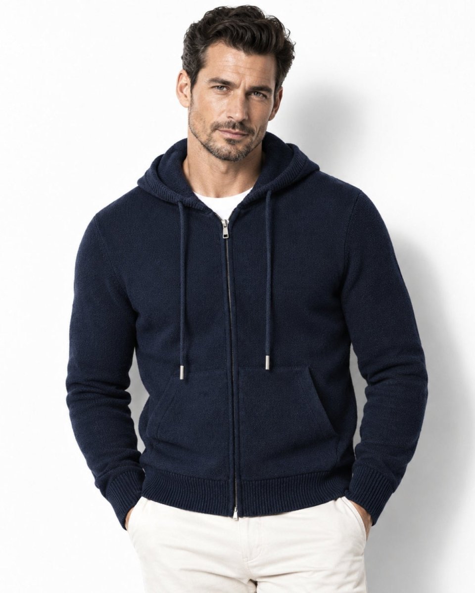 Male model wearing the men's luxury knit zip-up hoodie in navy blue, styled over a white t-shirt showcasing a tailored premium fit.
