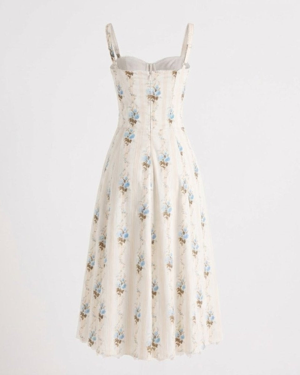 Back view flat lay of the Nefeli cream dress, showing the zipper closure and corset seam details.