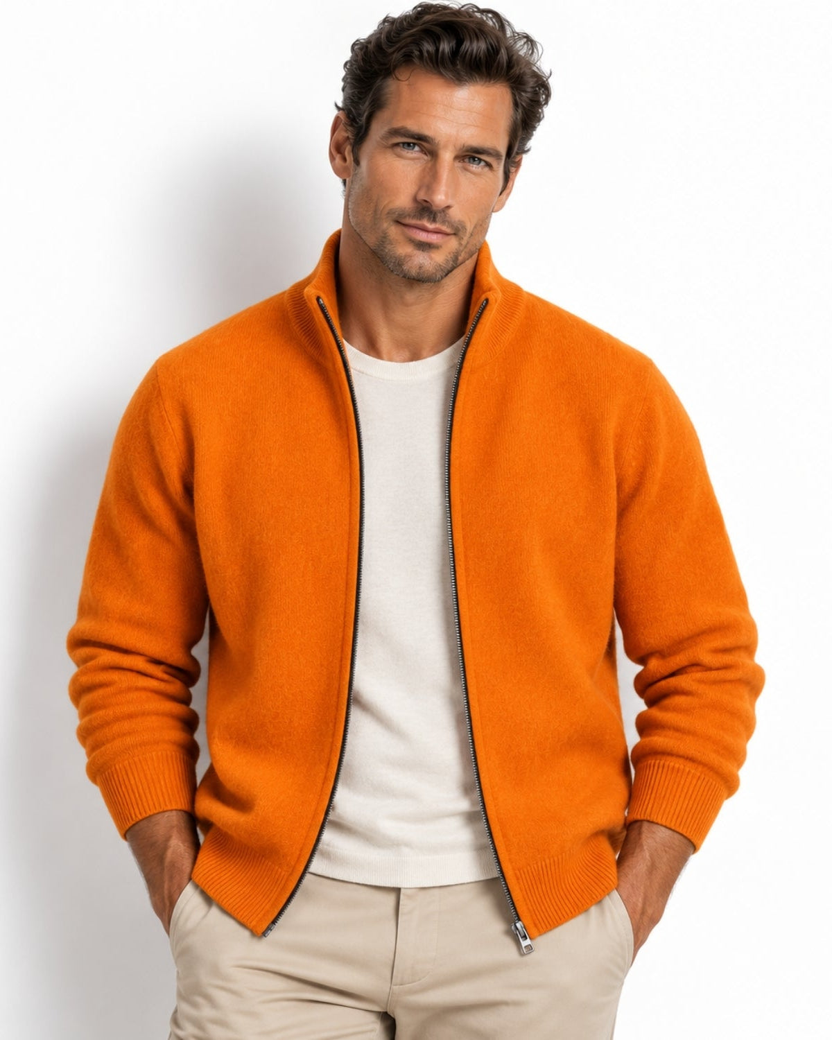 Man wearing a luxury orange cashmere full zip cardigan sweater with a mock neck 