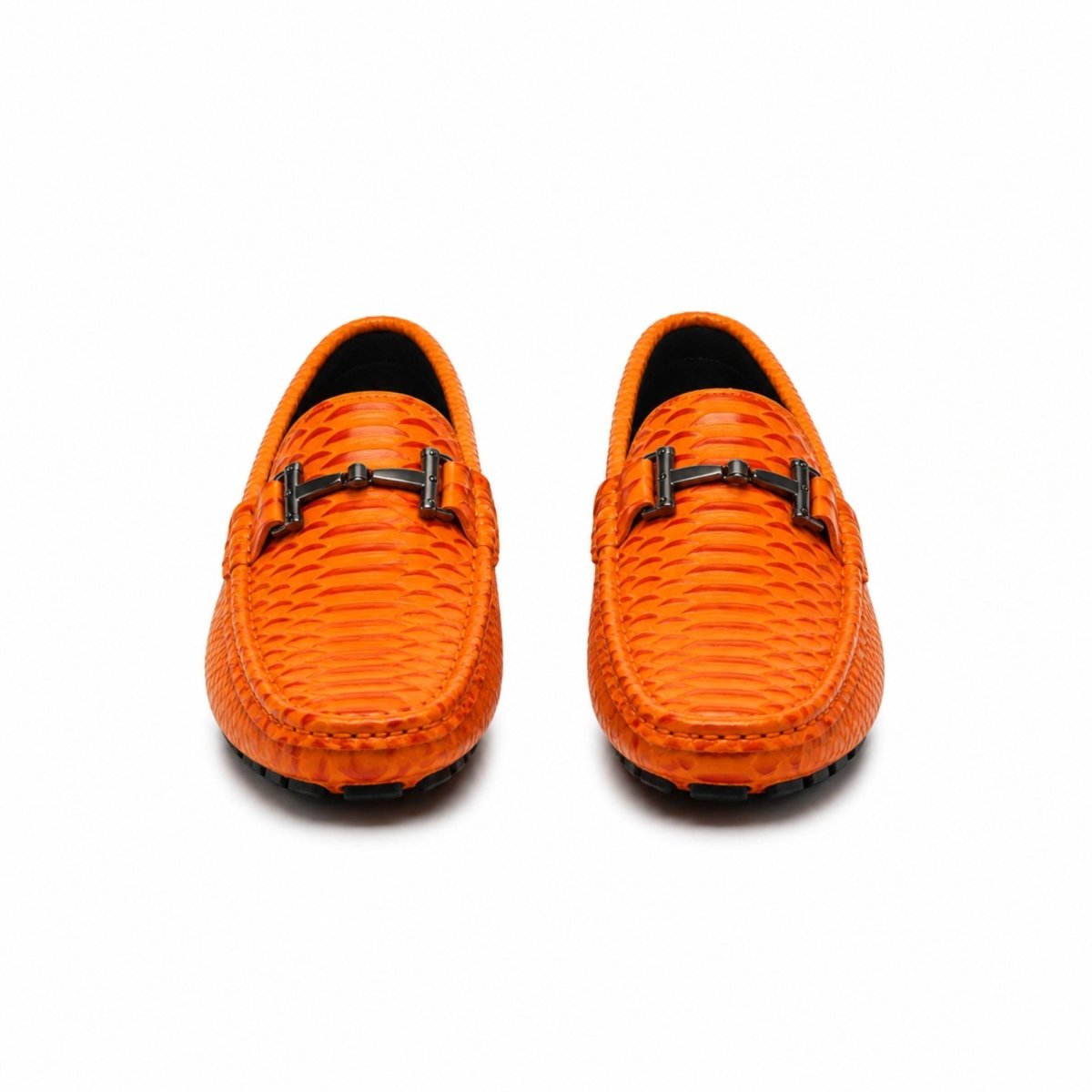 A pair of bright orange woven leather loafers with black metal horsebit-style buckles across the vamp, shown from a front-facing perspective on a white background.