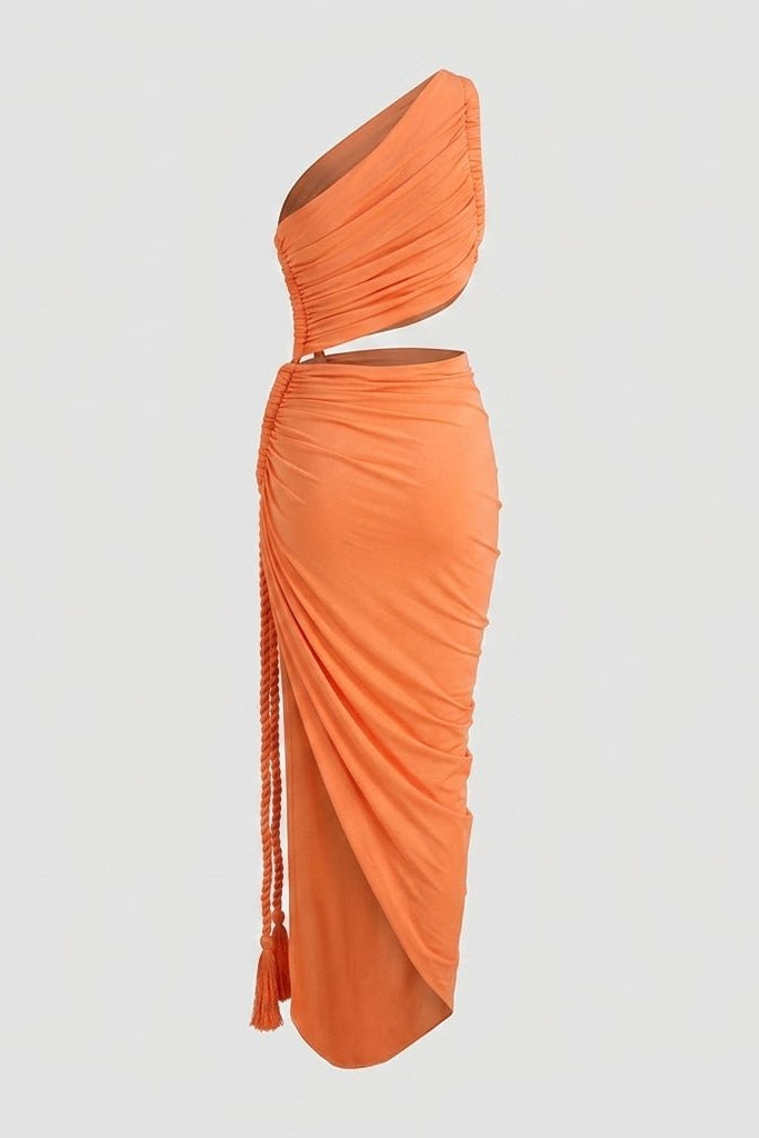 Detailed view of the orange luxury resort wear dress displaying the one-shoulder bodice, waist cutout, and tactile flowing fabric.