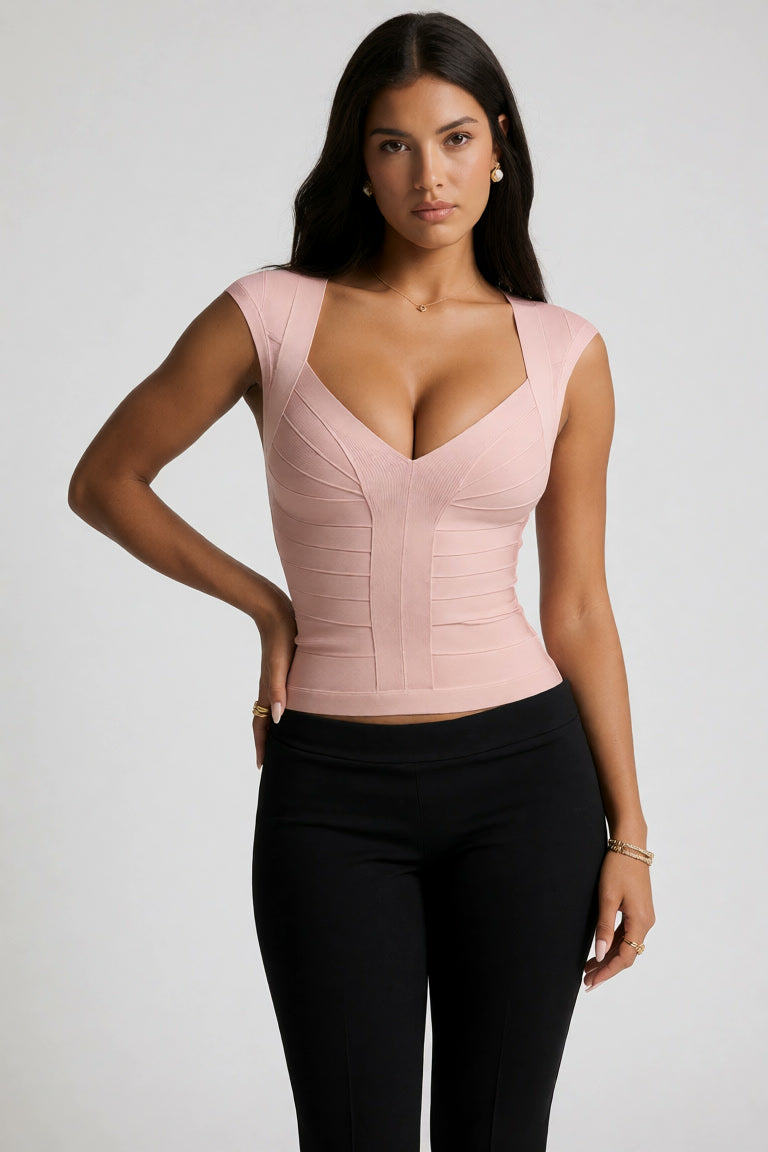 lush pink deep v-neck sculpting bandage top for women featuring architectural corset style seaming and thick premium knit.
