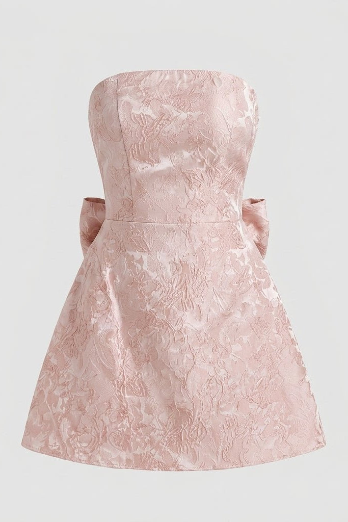 Studio flat lay product shot of a light pink floral brocade strapless A-line dress.