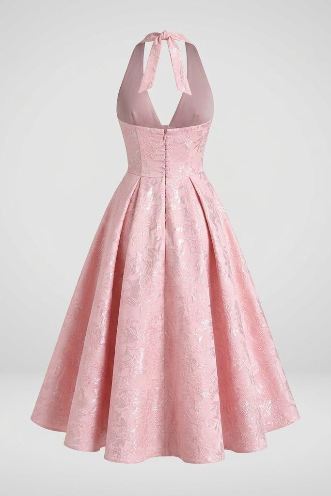 Ghost mannequin back studio view of pink backless halter dress showing invisible back zipper and elegant tied neck bow.