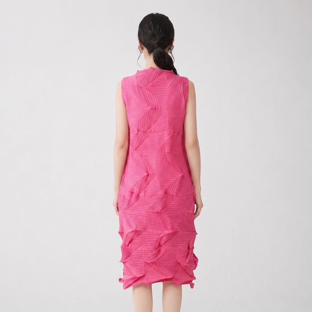 Back view of hot pink architectural pleated shift dress with invisible zipper.